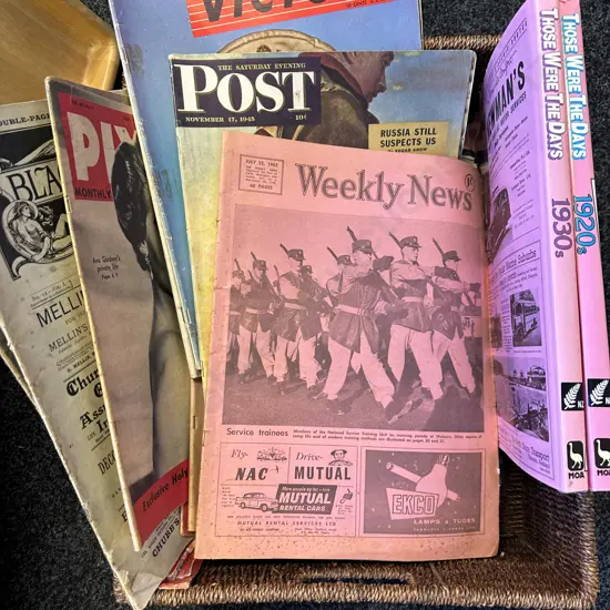 Double Handled Cane Basket With Vintage Magazines & Books Including The Weekly News, Victory, Post, Pix Etc